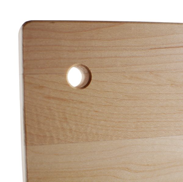 Small wood cutting board with a hole to hang it with.